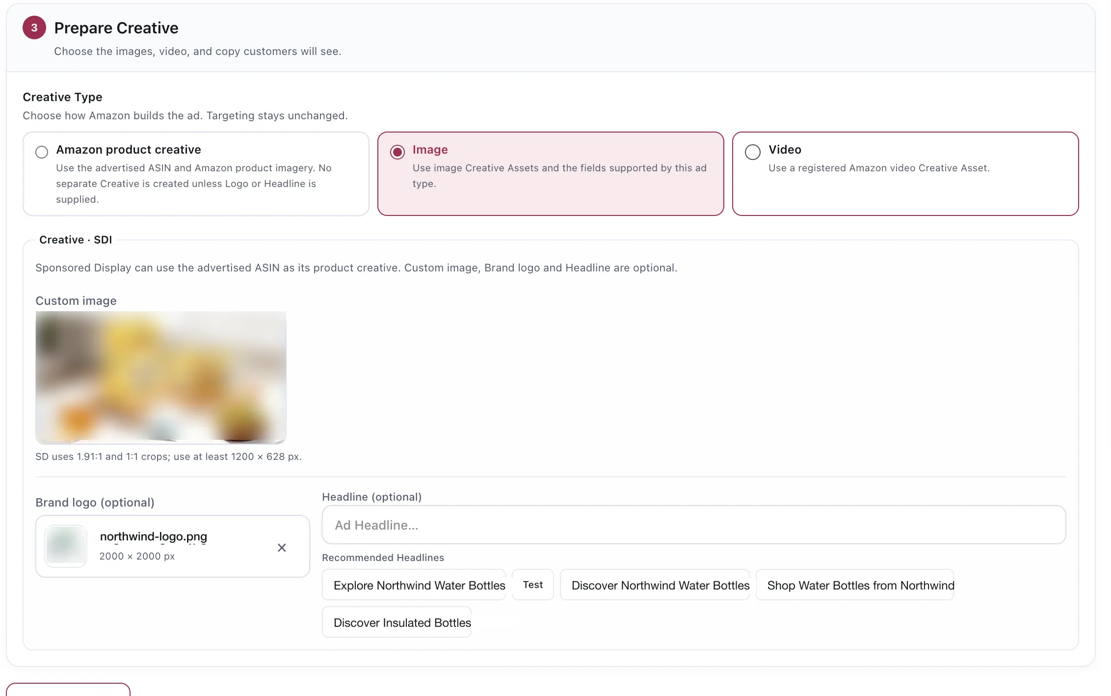 The Prepare Creative step. Creative Type offers Amazon product creative, Image or Video. Below it a creative panel with the fields required by the selected ad format and recommended headline suggestions where supported. Brand values are demo replacements; the image and logo are blurred.